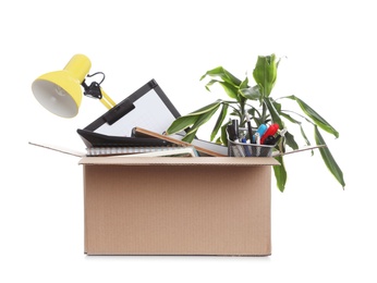 Cardboard box full of office stuff on white background