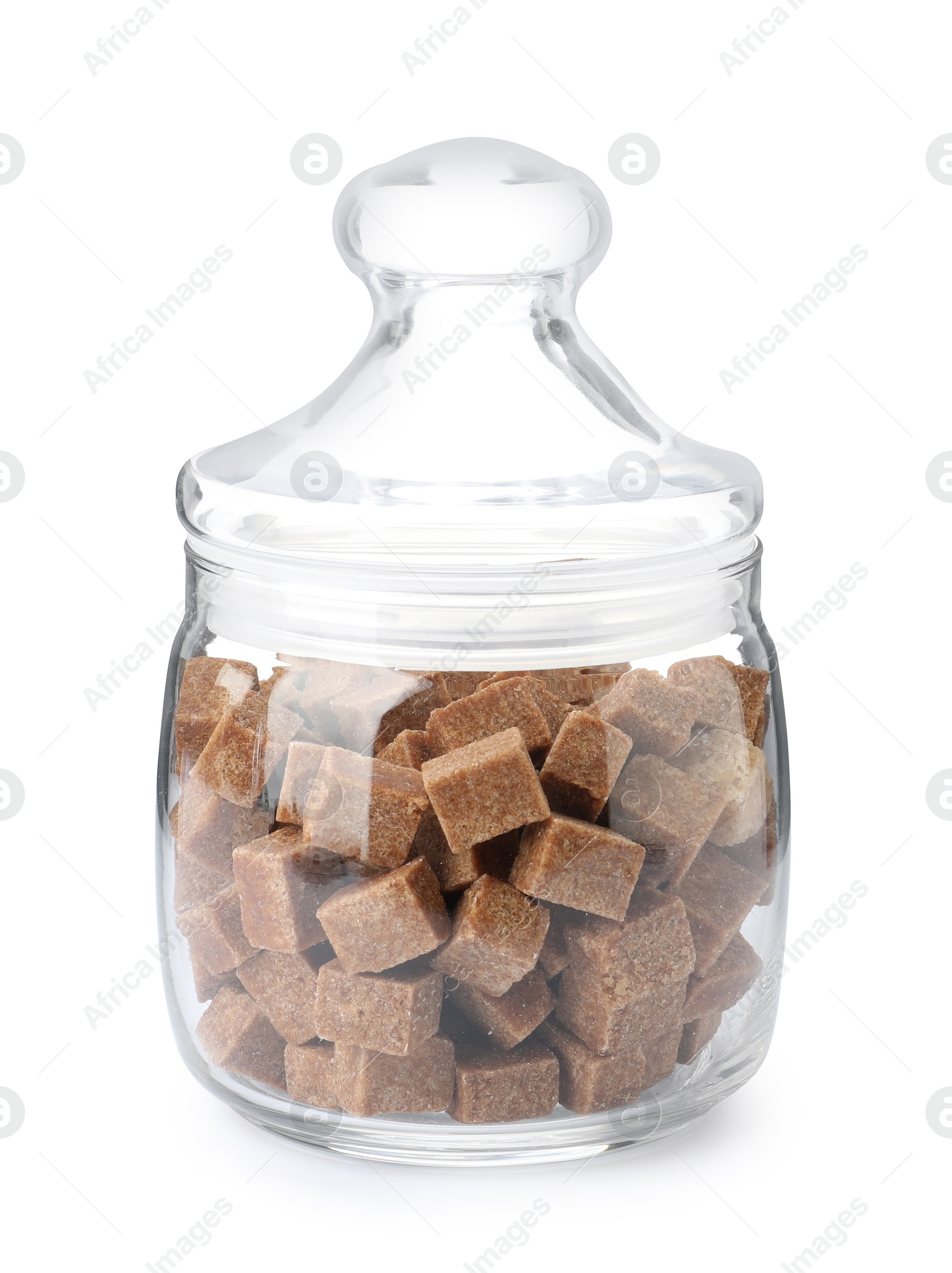 Photo of Glass jar with brown sugar cubes isolated on white