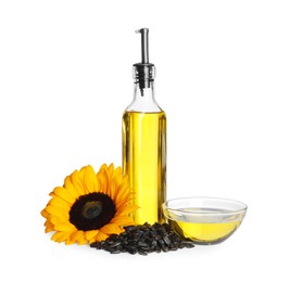 Photo of Sunflower cooking oil, seeds and yellow flower on white background