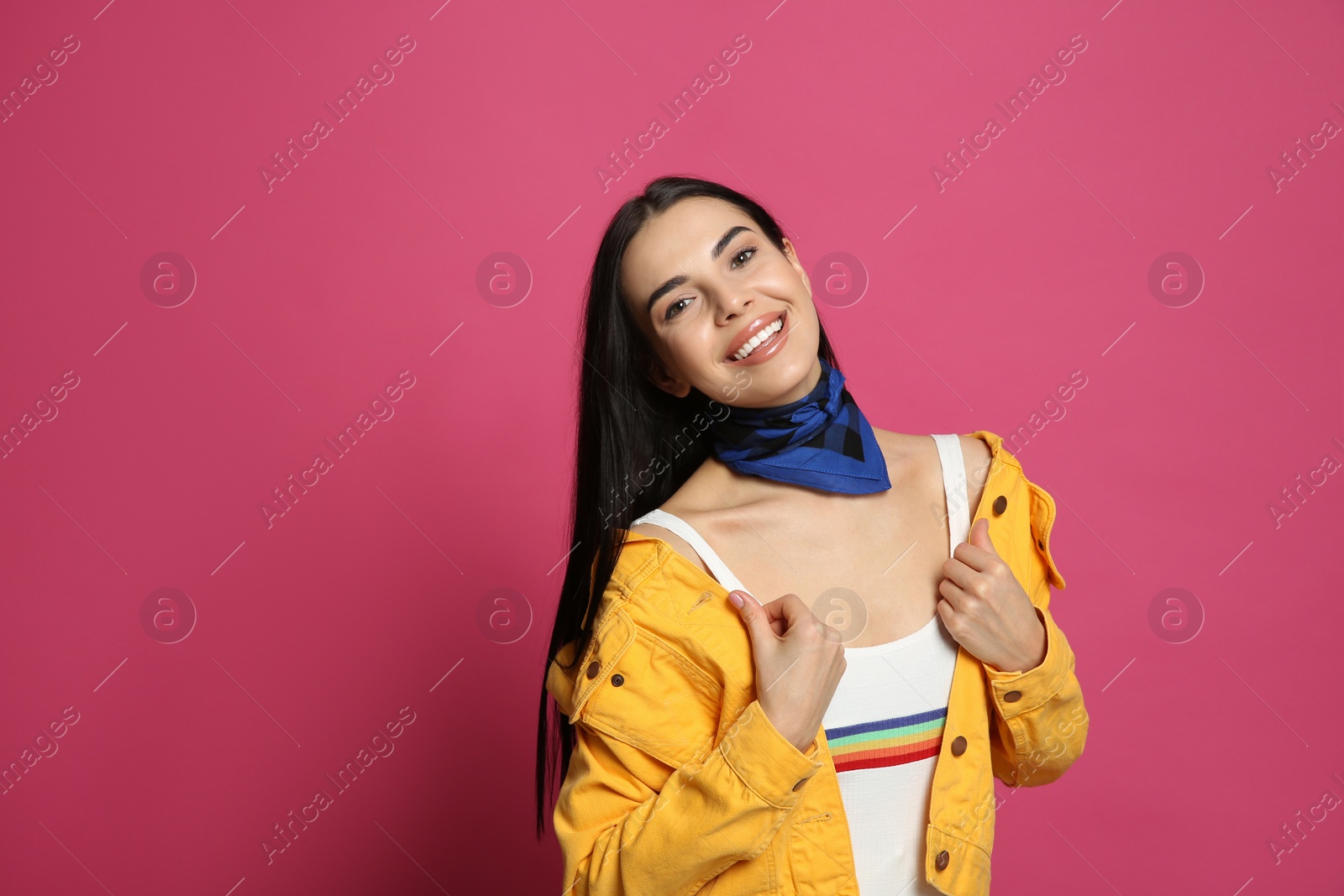 Photo of Fashionable young woman in stylish outfit with bandana on pink background, space for text