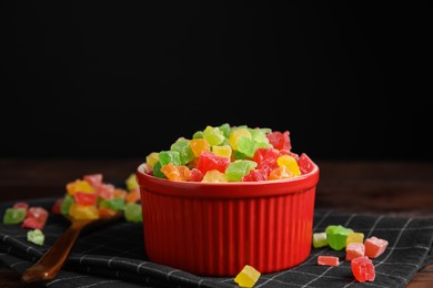 Photo of Mix of delicious candied fruits on table, space for text