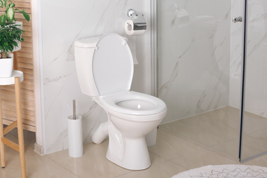 Photo of Stylish toilet bowl in modern bathroom interior