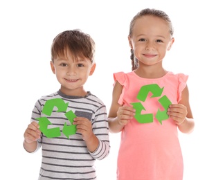 Little children with recycling symbols on white background