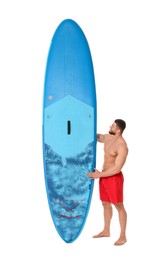 Handsome man with blue SUP board on white background