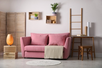 Photo of Modern living room interior with stylish pink sofa