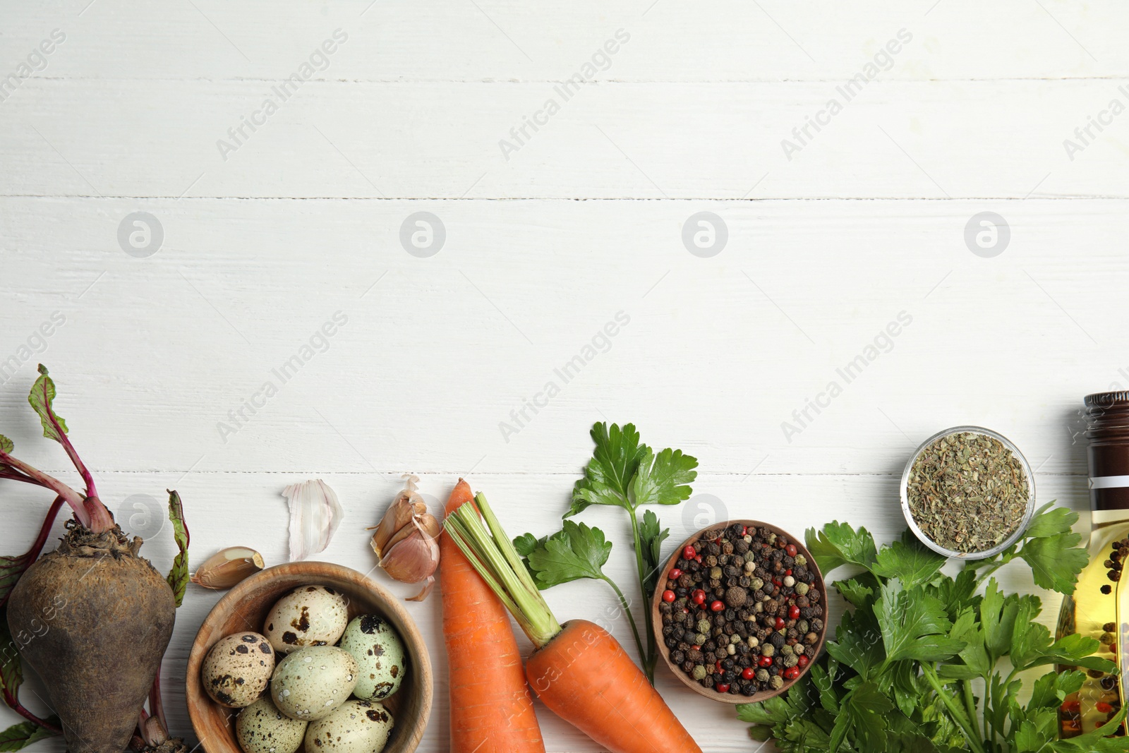 Photo of Flat lay composition with ingredients for cooking on white wooden table. Space for text