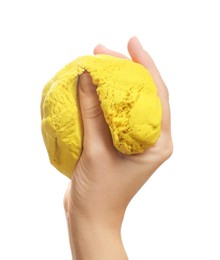 Photo of Woman playing with yellow kinetic sand on white background, closeup