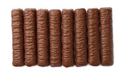 Photo of Sweet tasty chocolate bars on white background, top view