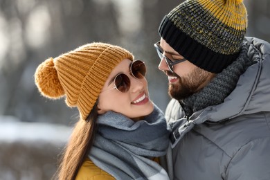 Beautiful happy couple outdoors on winter day