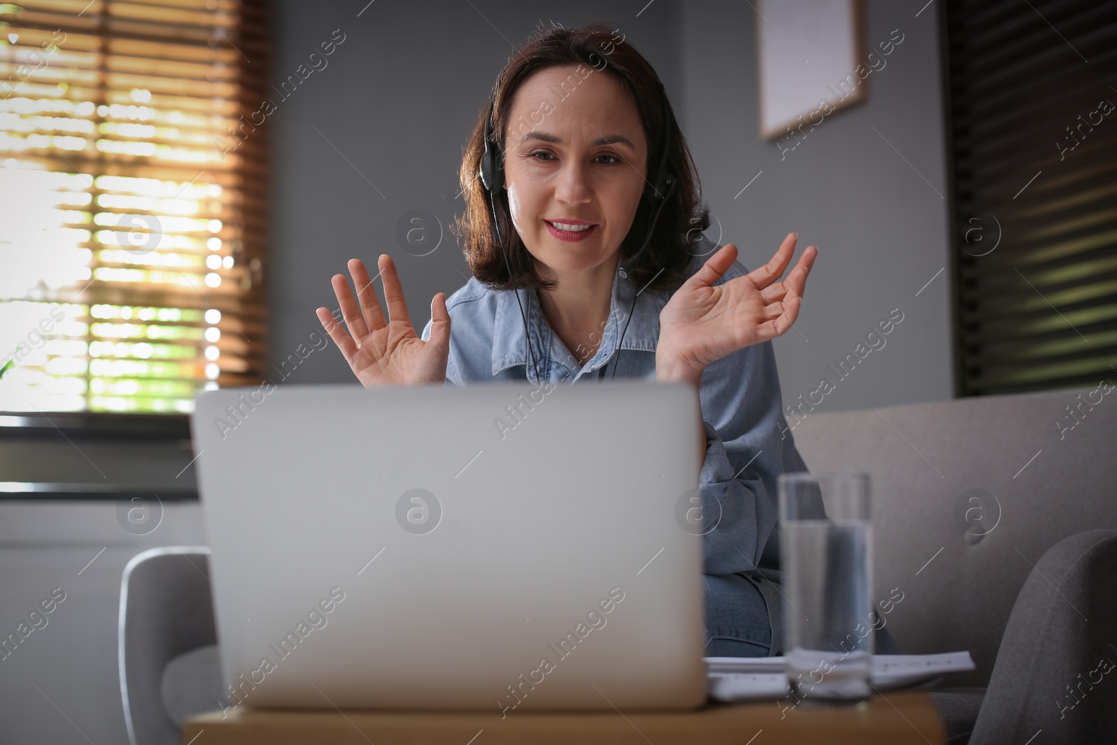 Photo of Teacher conducting online lesson at home during COVID-19 quarantine