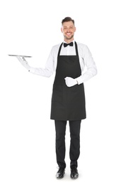 Photo of Handsome waiter with empty tray on white background