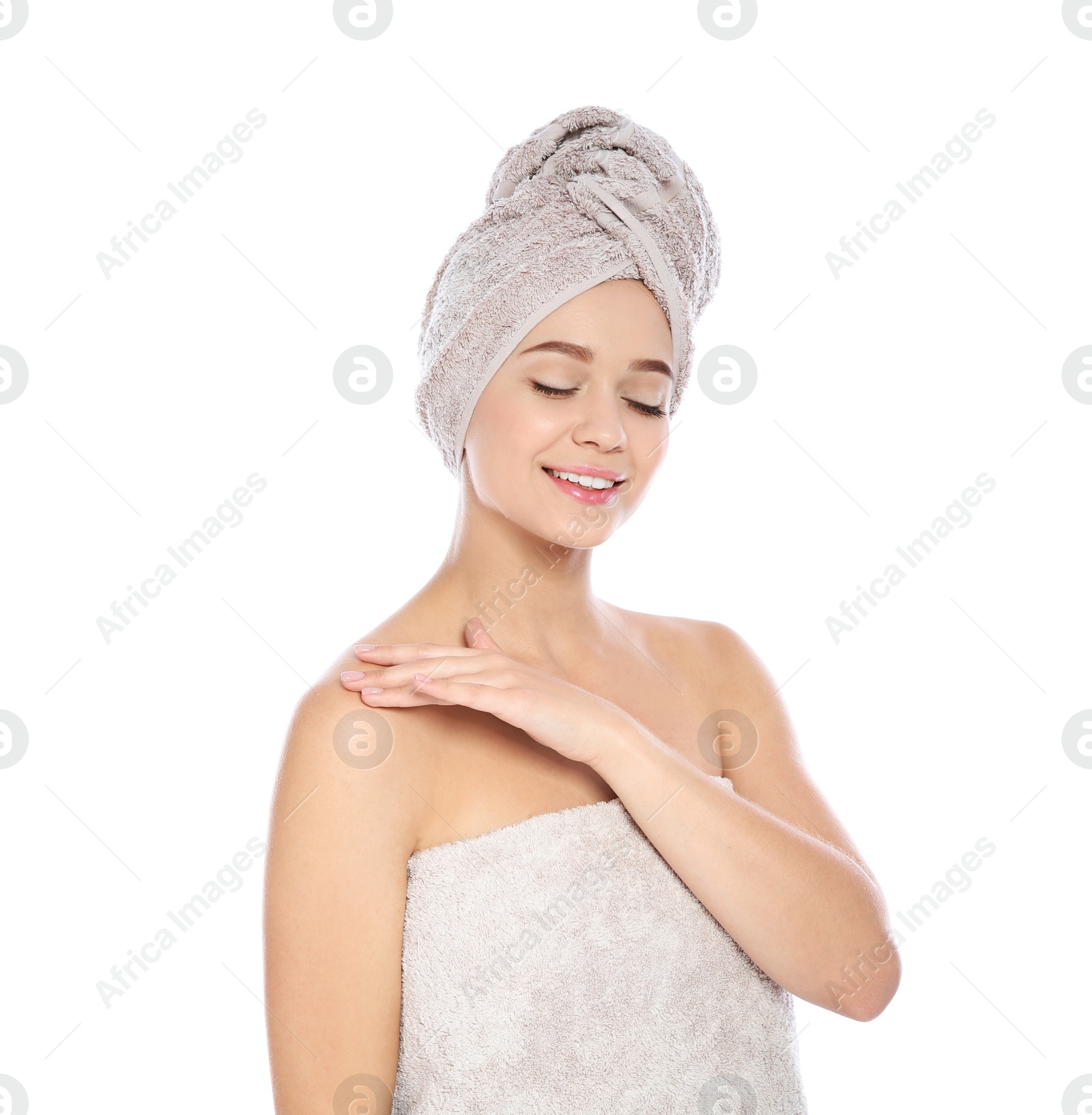 Photo of Portrait of young pretty woman with towels on white background