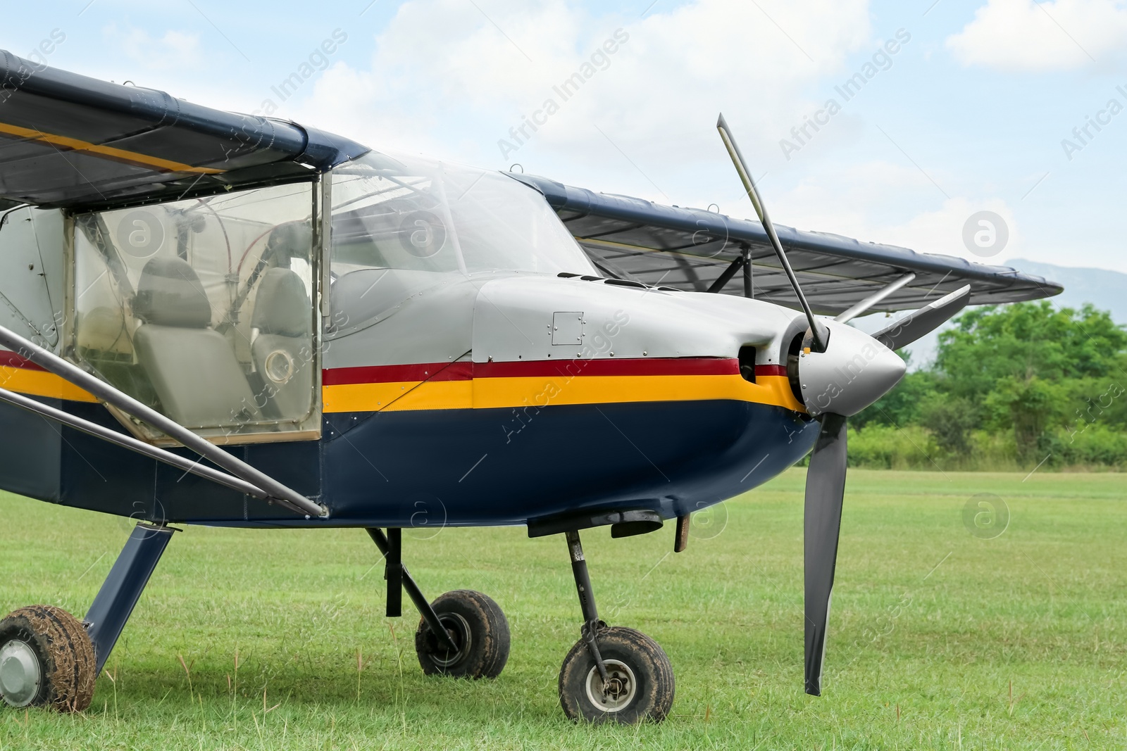 Photo of View of beautiful ultralight airplane in field on autumn day