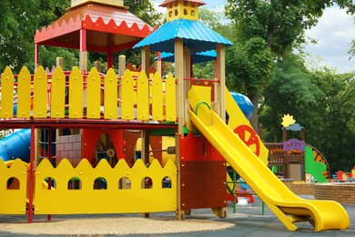 New colorful castle playhouse with slide on children's playground