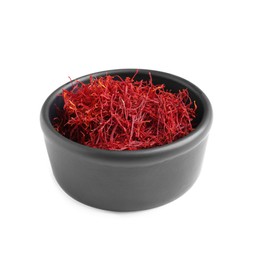 Photo of Dried saffron in bowl isolated on white