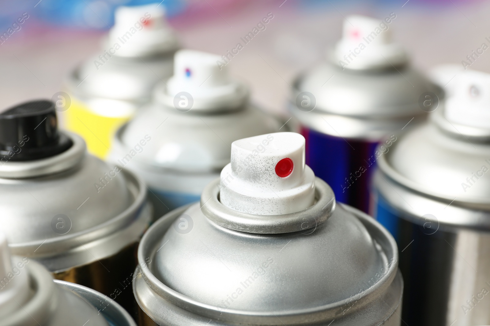 Photo of Used cans of spray paint, closeup view