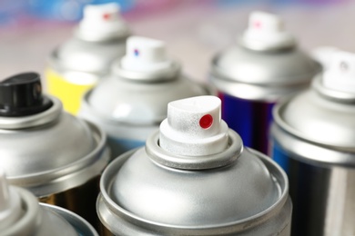 Used cans of spray paint, closeup view