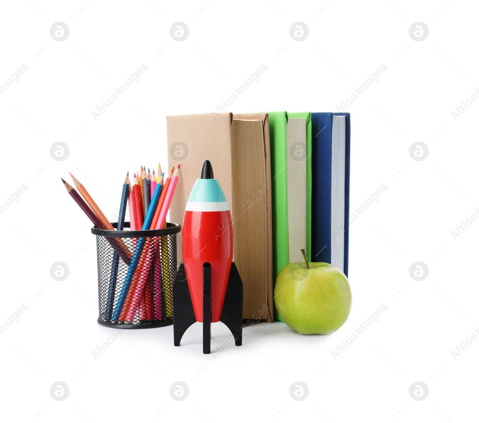 Photo of Bright toy rocket and school supplies on white background