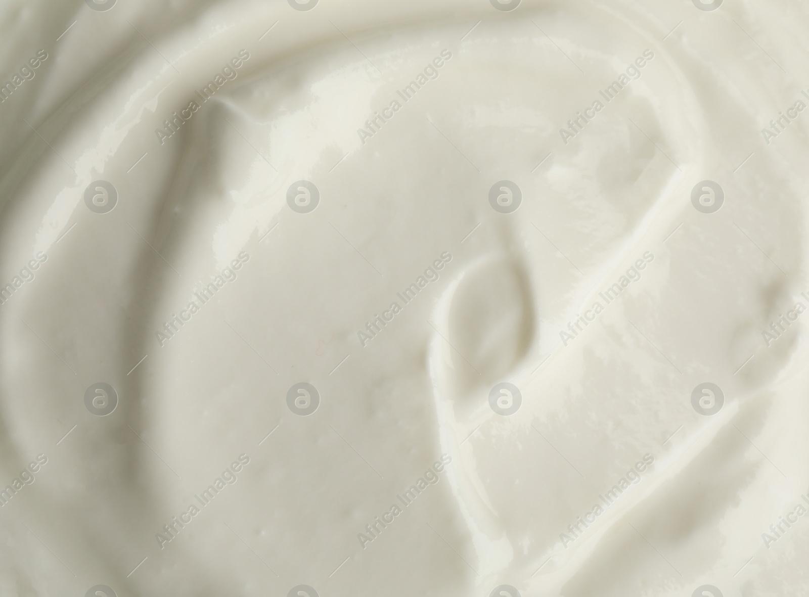 Photo of Tasty organic yogurt in bowl, top view