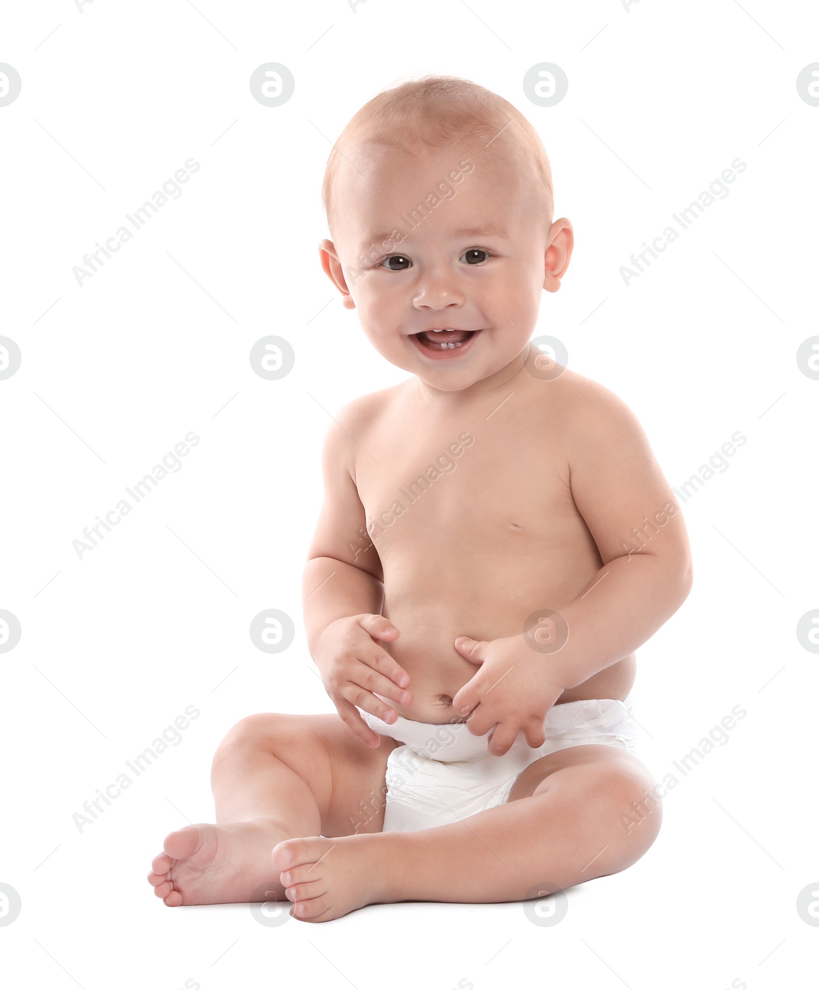 Photo of Cute little baby sitting on white background