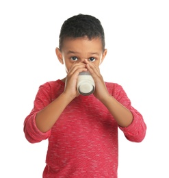 Photo of Adorable African-American boy with glass of milk on white background