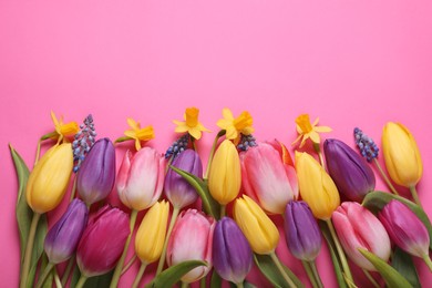 Beautiful different flowers on pink background, flat lay. Space for text