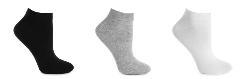 Image of Set with different socks on white background. Banner design