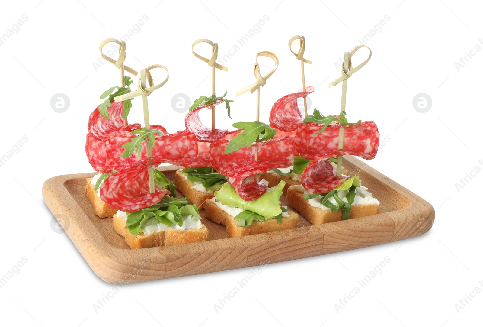 Photo of Tasty canapes with salami, greens and cream cheese isolated on white