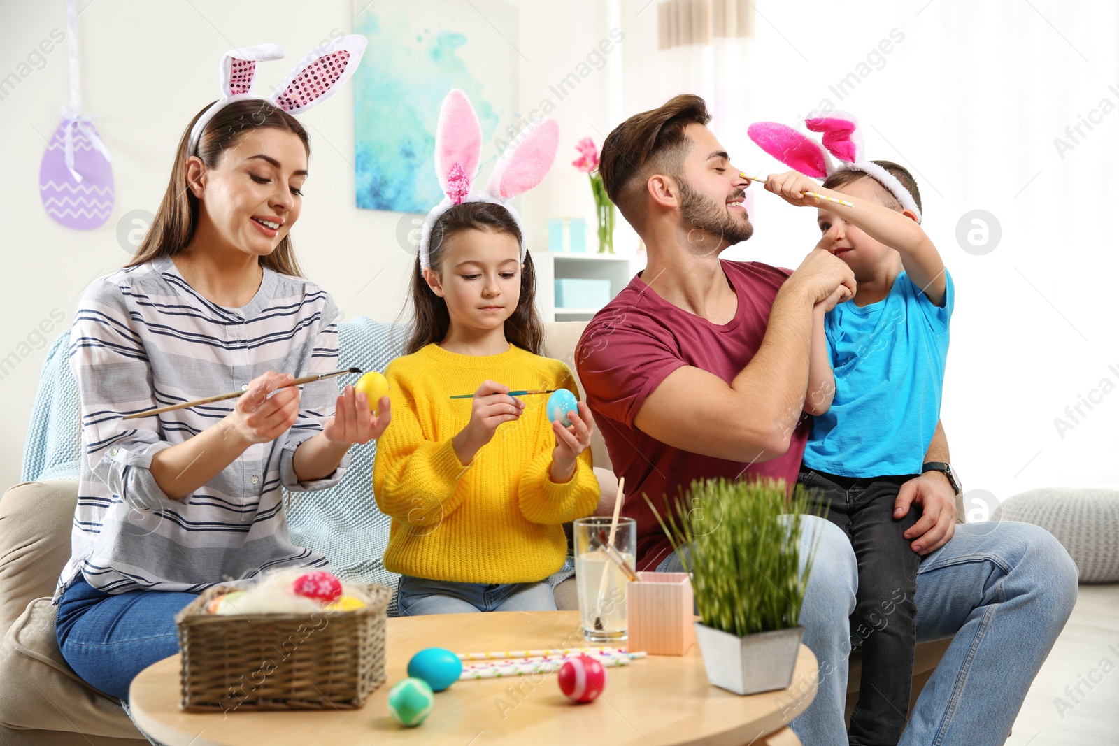 Photo of Happy family preparing for Easter holiday at home