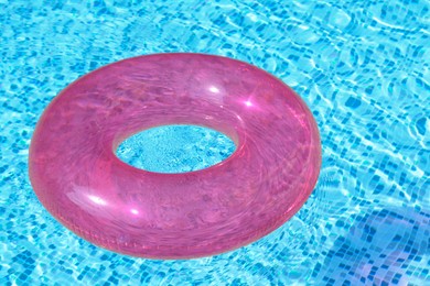 Photo of Inflatable ring floating on water in swimming pool