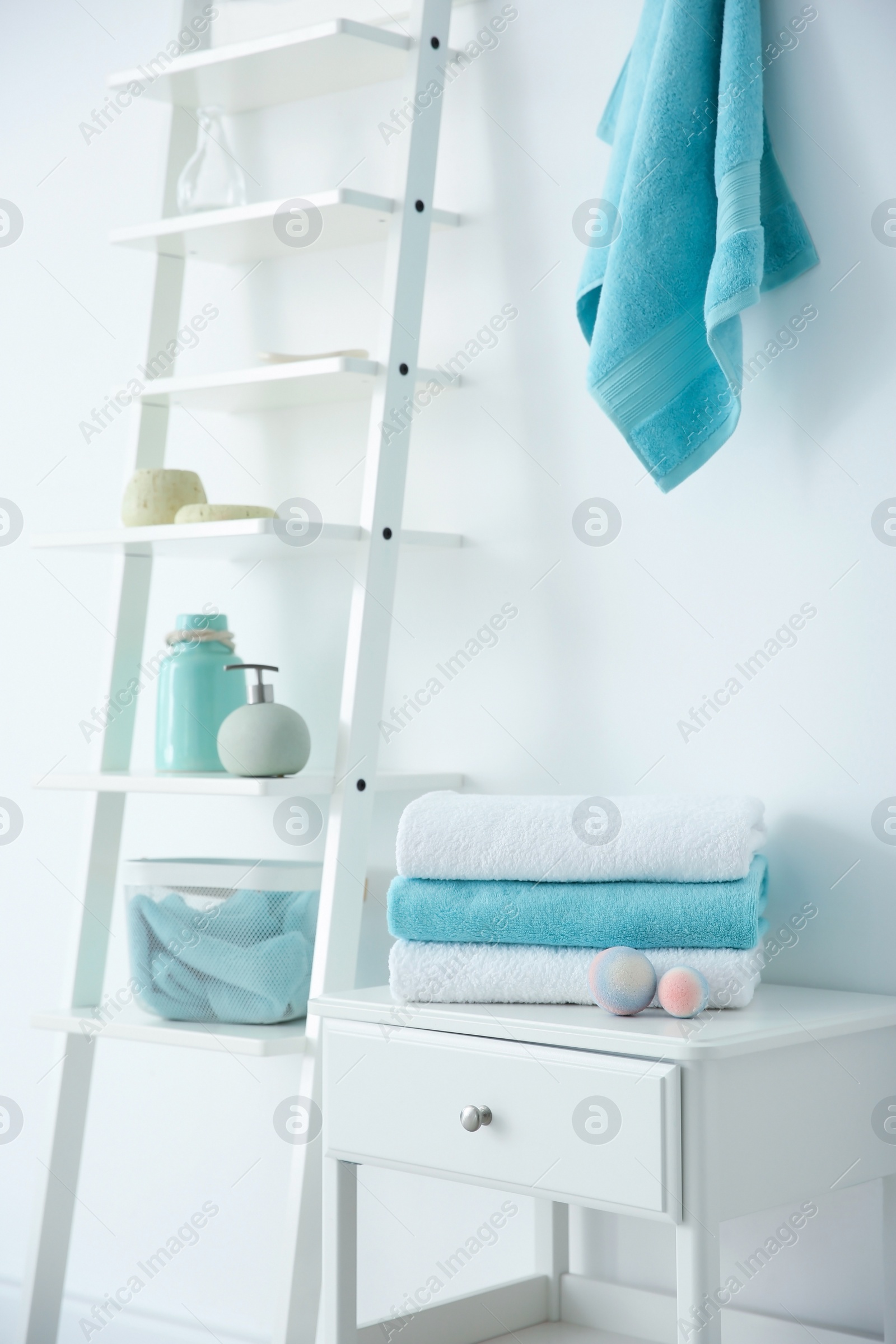 Photo of Room interior with clean towels and toiletries