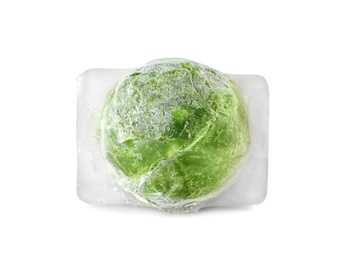 Photo of Brussels sprouts in ice cube on white background. Frozen vegetables