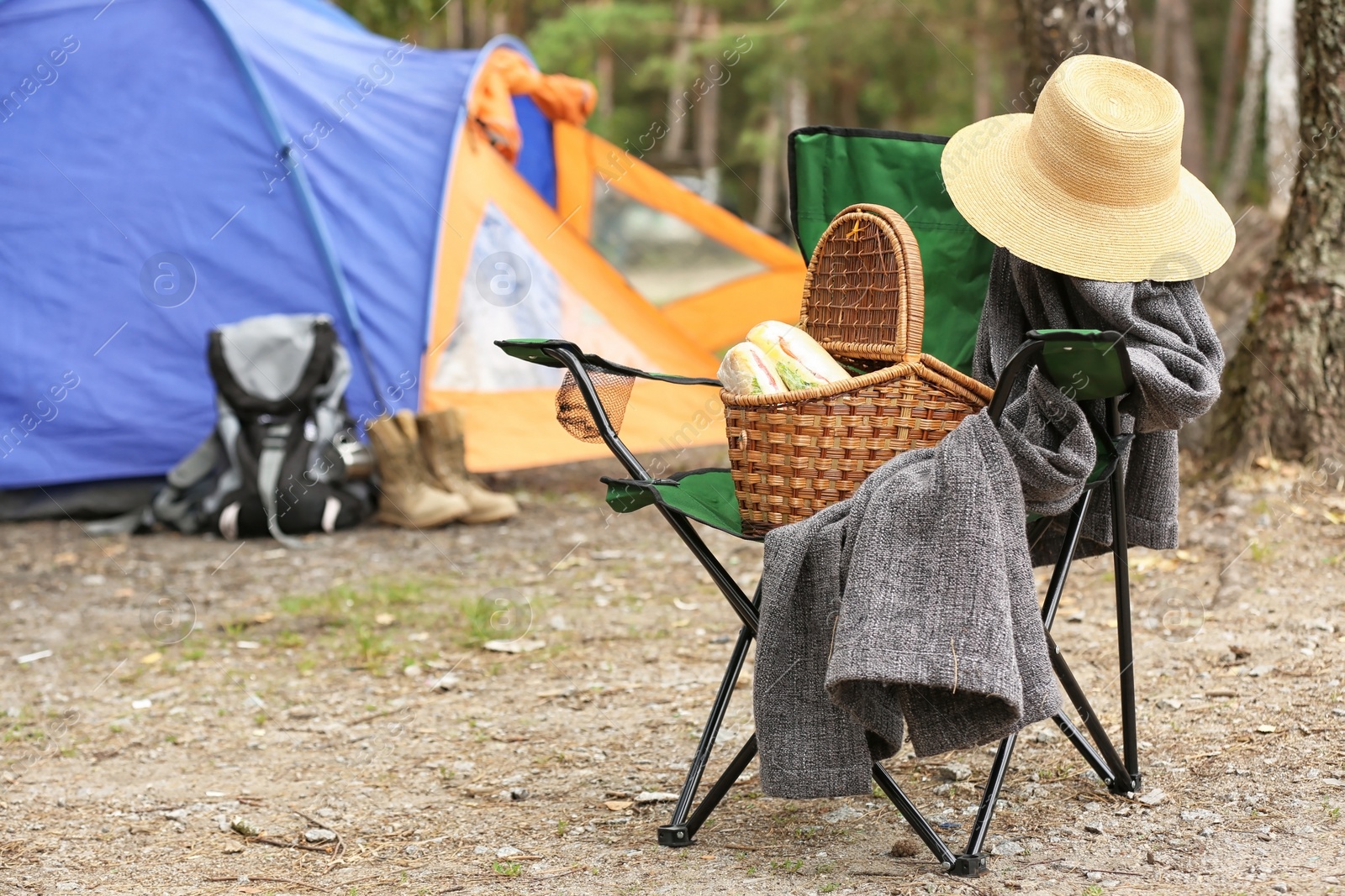 Photo of Set of camping equipment outdoors on summer day