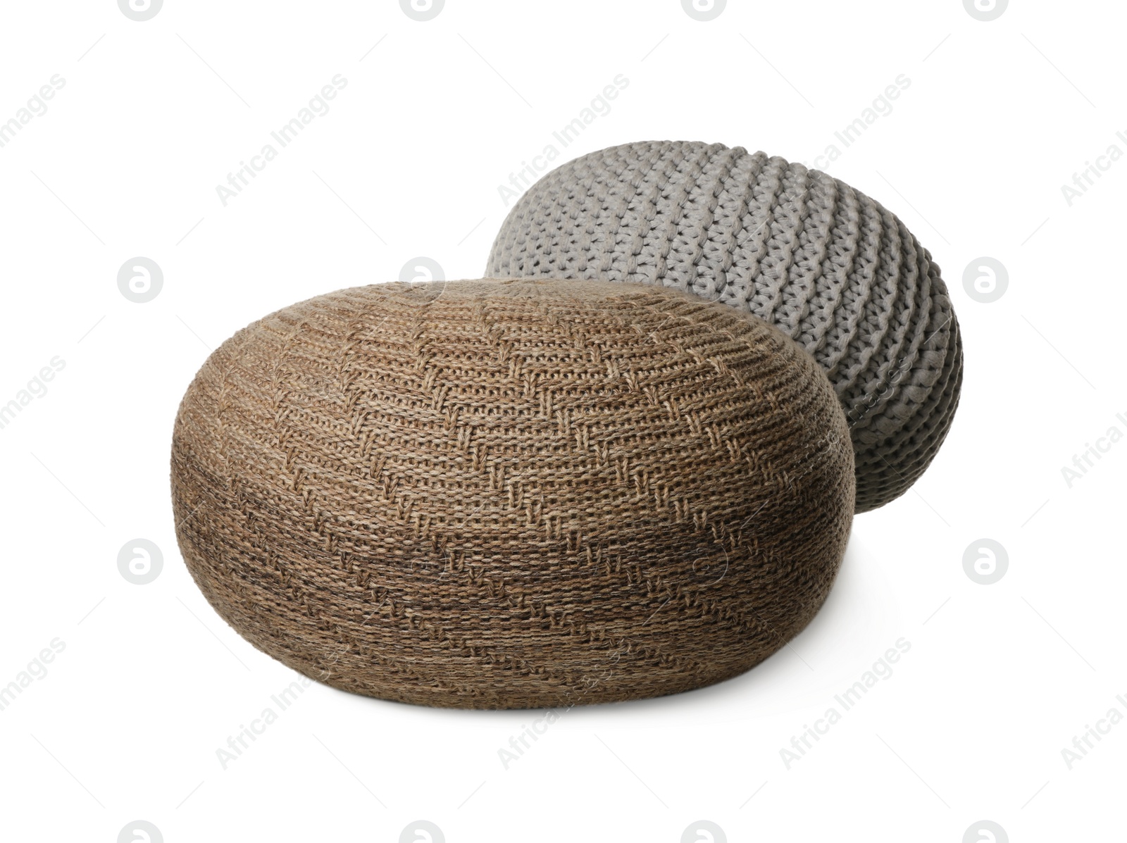 Photo of Different stylish knitted poufs on white background