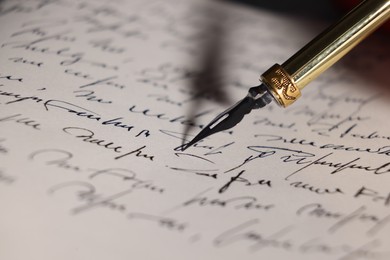 Photo of Writing letter with elegant fountain pen, closeup