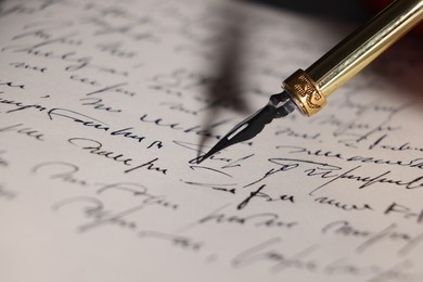 Writing letter with elegant fountain pen, closeup