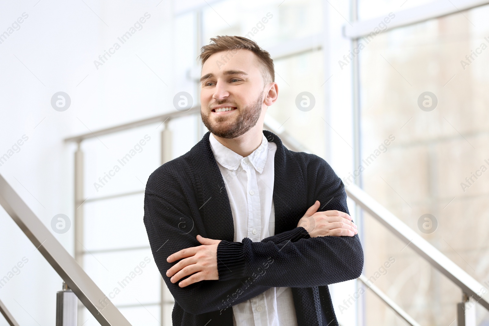 Photo of Portrait of confident young man on stairs