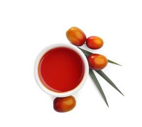 Photo of Palm oil in bowl, tropical leaf and fruits isolated on white, top view