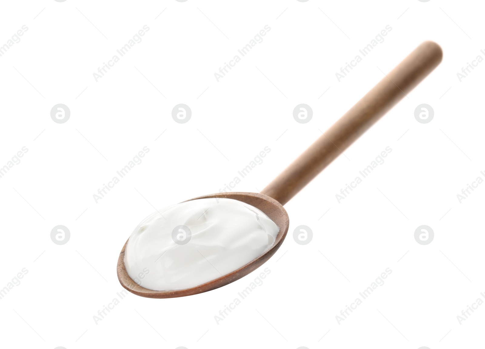 Photo of Spoon with creamy yogurt on white background