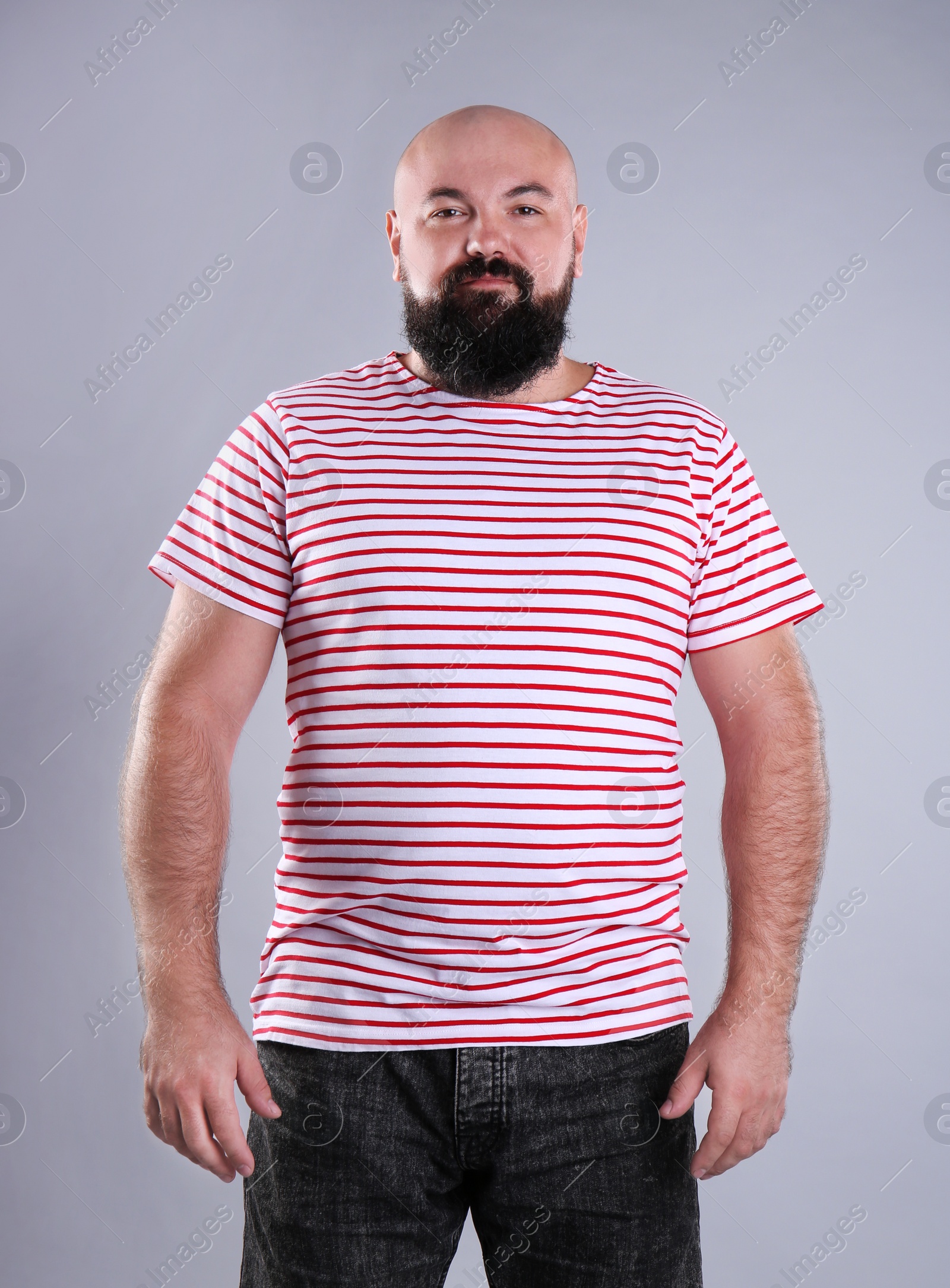 Photo of Fat man on grey background. Weight loss