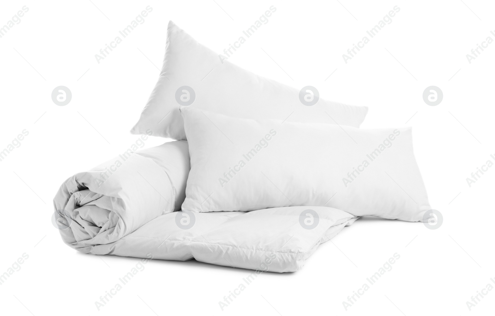 Photo of Soft blanket and pillows on white background