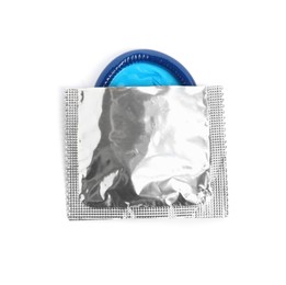 Photo of Torn condom package isolated on white, top view. Safe sex