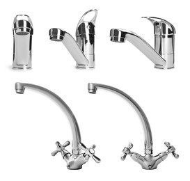 Image of Set with new water faucets on white background 