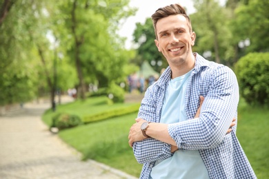 Photo of Portrait of young man in stylish outfit outdoors