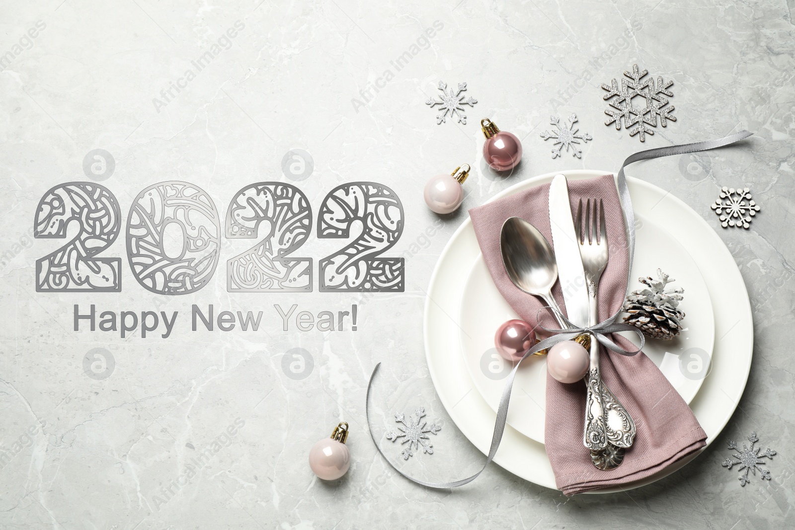 Image of Happy New 2022 Year! Beautiful table setting and festive decor on light grey marble background, flat lay