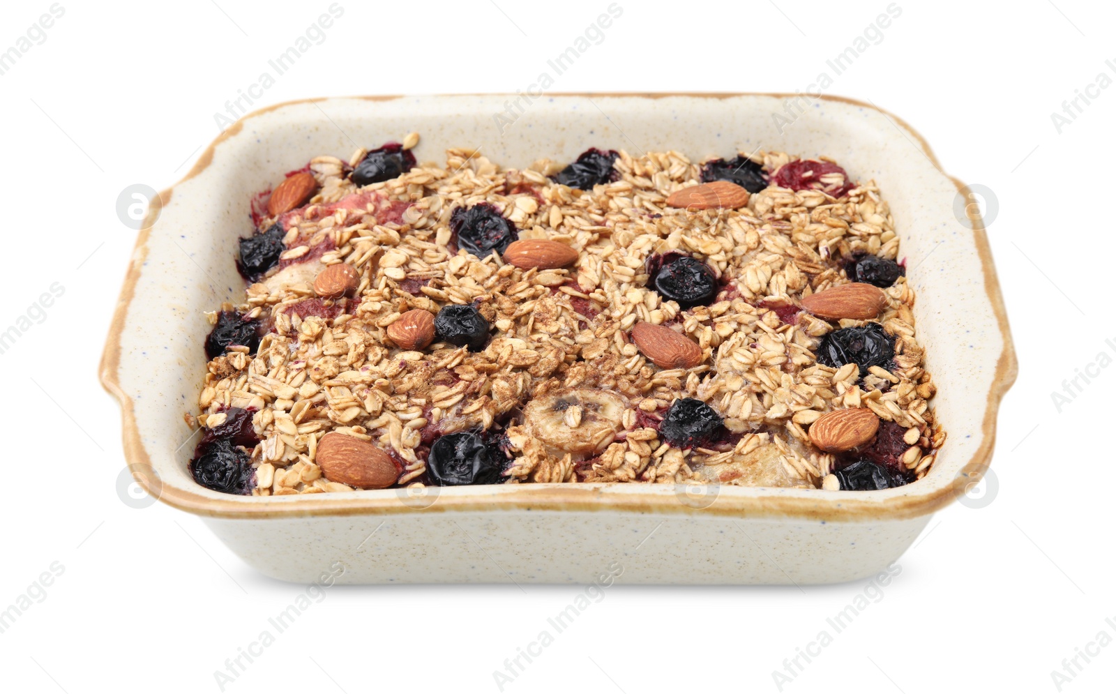 Photo of Tasty baked oatmeal with berries and almonds in baking tray isolated on white