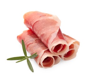 Photo of Rolled slices of delicious jamon and rosemary isolated on white