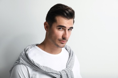 Portrait of handsome young man on white background