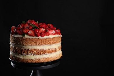 Tasty cake with fresh strawberries and mint on black background, space for text