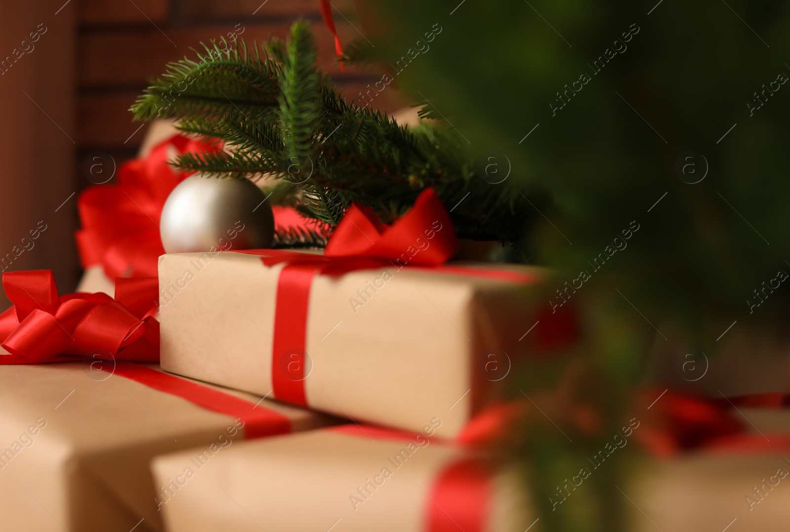 Photo of Beautiful Christmas tree and gift boxes in room